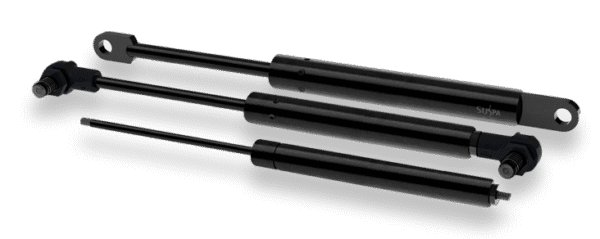 Tres resortes de gas SUSPA de diferentes tamaños con cuerpo negro y vástago delgado, mostrando diversas terminaciones de conexión.